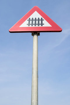 Dutch road sign: level crossing with barrier or gates ahead