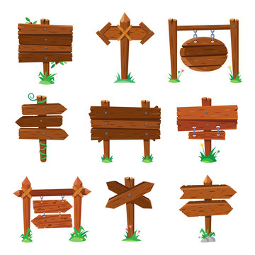 Sign boards in green grass. Wooden plank road signs, wood signboard or isolated signpost board cartoon vector set