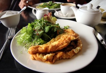 Omlette with mushrooms and lettuce