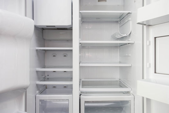 White Open Empty Refrigerator. Weight Loss Diet Concept.