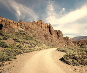 road through rocky desert around the volcano