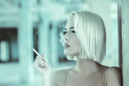 girl smokes cigarette