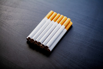 Stop smoking concept on background with broken cigarettes. Heap of cigarettes. No smoking