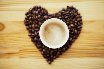 Good Morning. Coffee Time. Coffee to go and beans on a wooden background