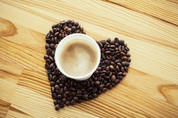 Good Morning. Coffee Time. Coffee to go and beans on a wooden background