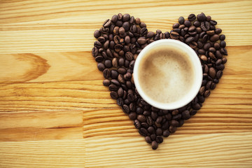 Good Morning. Coffee Time. Coffee to go and beans on a wooden background