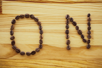Good Morning. Coffee Time. Coffee to go and beans on a wooden background