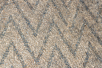 Floor with an ornament from a natural pebble in an ancient monastery