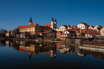 Obraz premium Telc city sight reflected in the lake - Telc castle. UNESCO World Heritage Site. Renaissance castle Telc in Czech Republic.