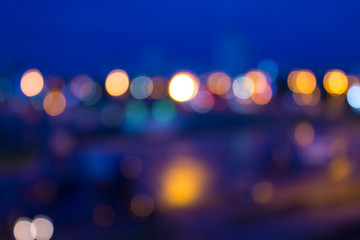 Defocused background of a cityscape at night. Abstract background with bokeh and lights