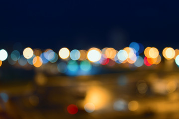 Defocused background of a cityscape at night. Abstract background with bokeh and lights