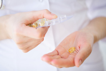 Closeup Of Woman Hands Holding Variety Of Colorful Vitamin Pills. Close-up Handful Of Medication, Medicine Tablets, Capsules. Healthy Diet Nutrition Concept. High Resolution