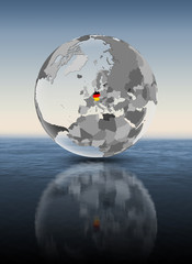 Germany on translucent globe above water