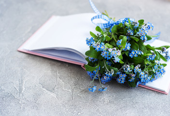 Forget me not flowers and notebook