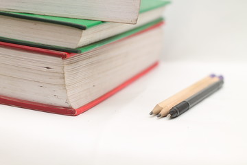 books, pens and pencils