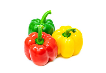 fresh colorful bell peppers isolated on white background