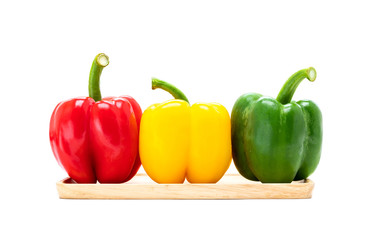 fresh colorful bell peppers isolated on white background