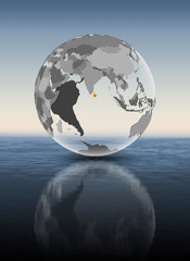Sri Lanka on translucent globe above water
