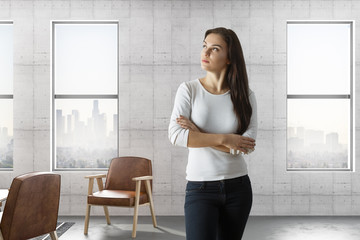 woman in loft room with city view