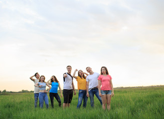 Fototapeta premium Group of young people on the field