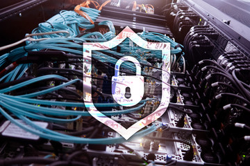Cyber protection shield icon on server room background. Information Security and virus detection.