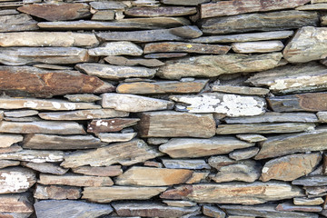 stone fence of solid pieces of stone