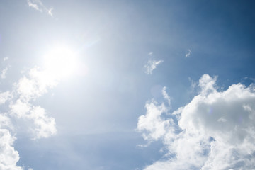 Sun and cloud on blue sky background