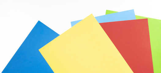 Colourful paper sheets on white background