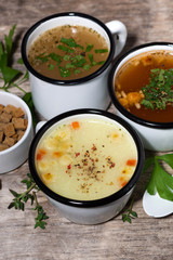 hot soups in mugs, vertical