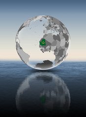 Mauritania on translucent globe above water