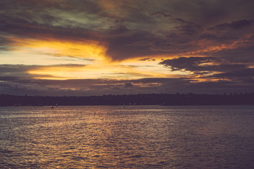 Naklejka na ściany i meble Beautiful sunset on the Sydney Harbour bay in Australia
