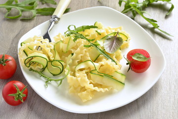 Italian pasta noodles with zucchini, arugula, basil