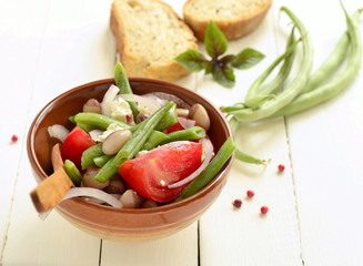 Bean salad with tomatoes, green beans and feta, copy space