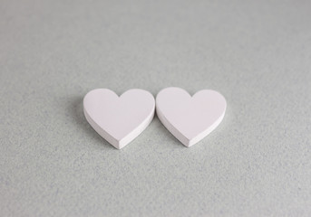 Fototapeta premium two wooden hearts on craft background