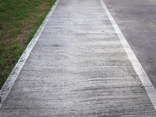 Perspective Footpath Along the Green Grass Field