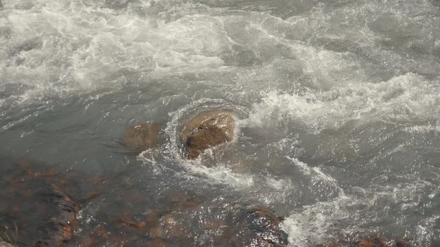 Mountain clean river. Cold fast river slow motion video