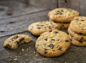 Chocolate cookies on natural wooden table.