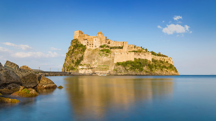 Fototapeta na wymiar Castello Aragonese near Ischia island, Italy. Long exposure daylight image