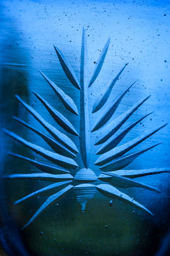 Etched Detail on a Blue Glass