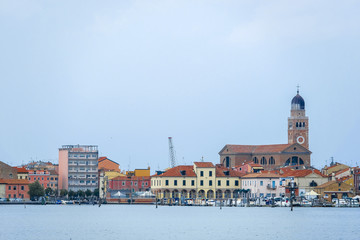 Obraz premium Sottomarina, Italy - July, 11, 2018: sea embankment in Sottomarina, Italy