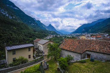 Fototapeta na wymiar Longarone, Italy - July, 12, 2018: Alpine landscape with the image of Longarone, Italy