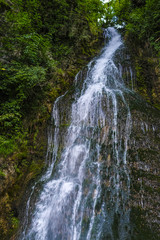 Alpine landscape with the image of waterfall