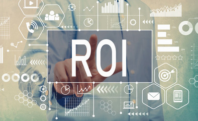 ROI with businessman pointing a digital screen