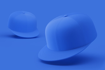 Two blank baseball caps isolated on a blue background. Mock up. 3d rendering
