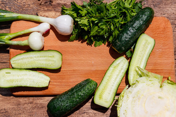 Ingredients for spring vegetable salad on rustic wooden table