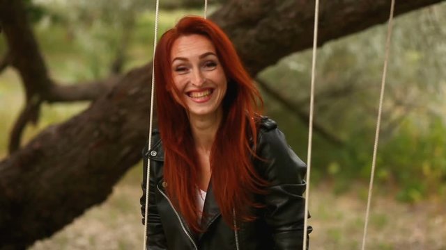 A redhead woman making selfie and showing funny face