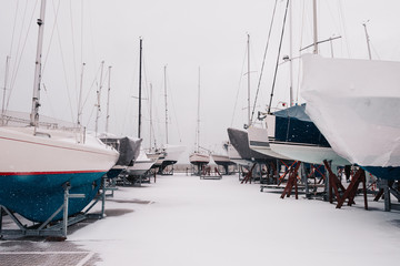Sailboats on land in snow storm