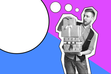 Inscription template Man holding box with Christmas gifts in hands. Bearded hipster gives Christmas gifts. Christmas sale, discounts on purchases. A man with a beard gives presents