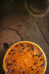 blueberries and lavander cheesecake served on oven with berries and flowers, still life for patisserie, healthy cake
