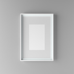 Elegant and minimalistic picture frame with parspartu standing on gray wall